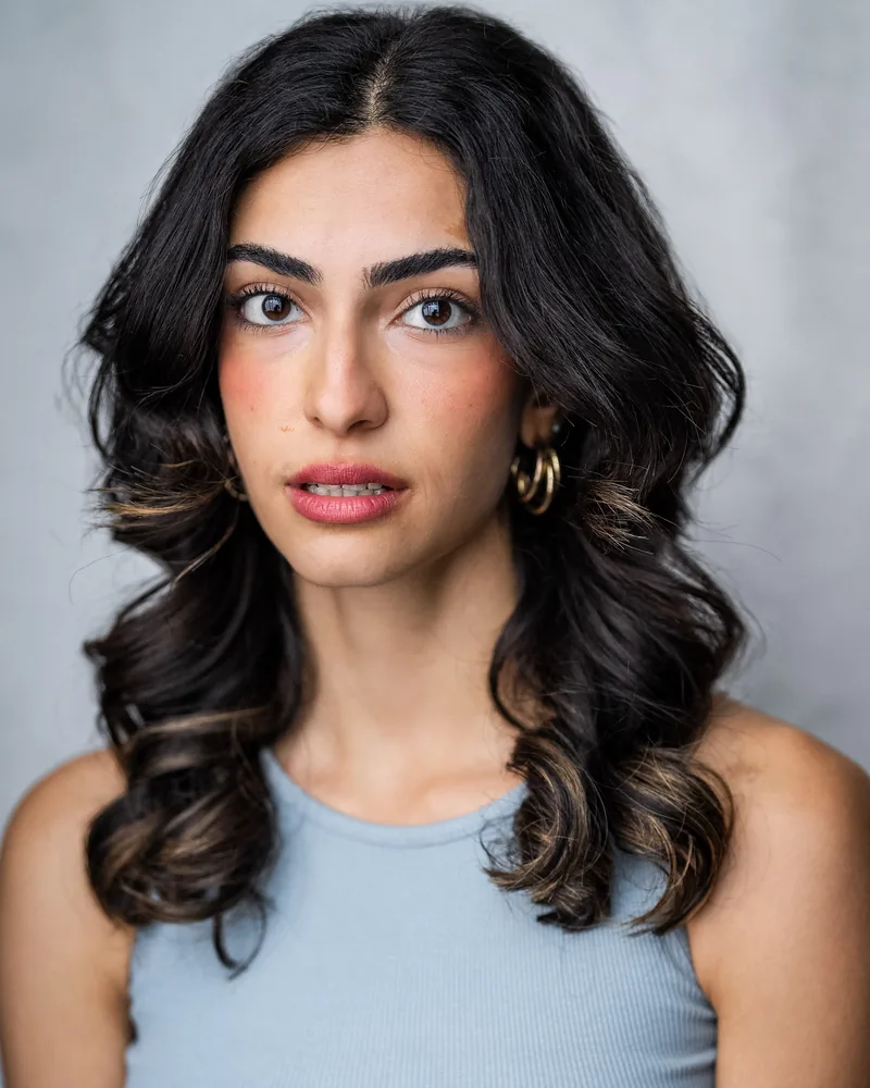 Elvin Köse, headshot by YellowBellyPhoto, grey-blue top