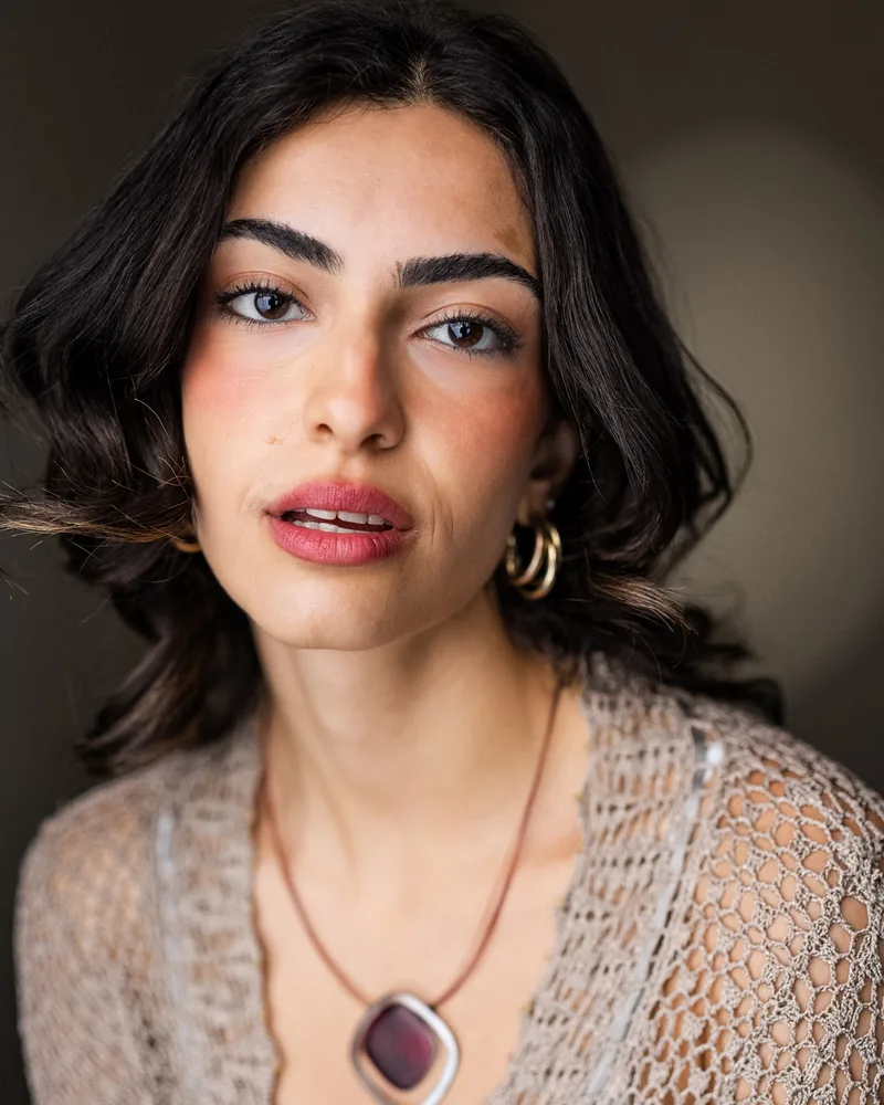 Elvin Köse, headshot by YellowBellyPhoto, knit cardigan